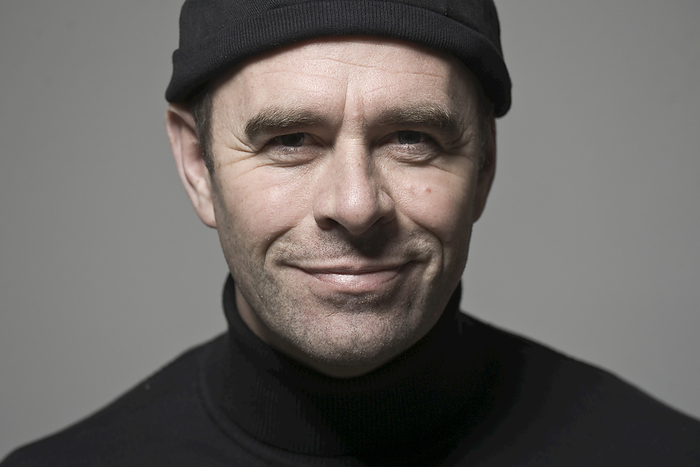 Portrait of Man in Black Cap, by Uwe Umstätter / Design Pics
