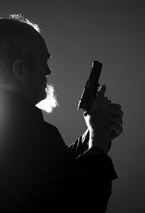 Backlit Man with Gun, Mannheim, Baden-Wurttemberg, Germany, by Uwe Umstätter / Design Pics