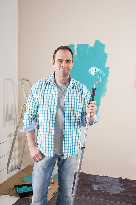 Mature Man Renovating his Home by Painting the Walls, by Uwe Umstätter / Design Pics