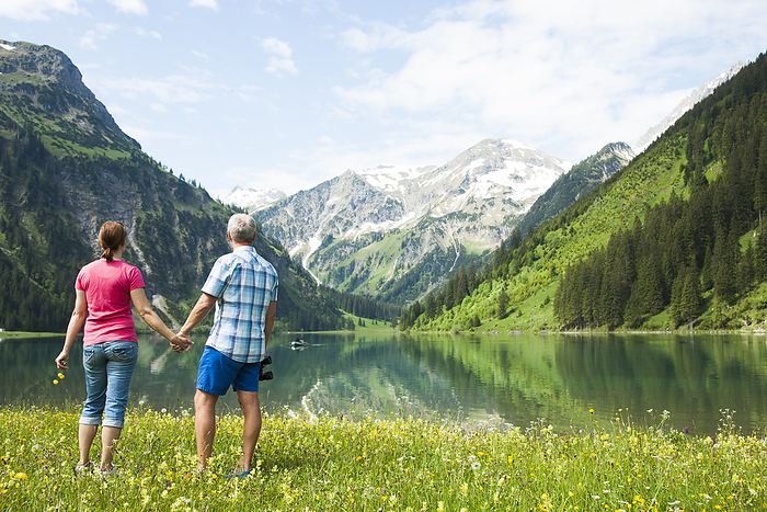 Couple Hiking by Lake, Vilsalpsee, Tannheim Valley, Tyrol, Austria, by Uwe Umstätter / Design Pics