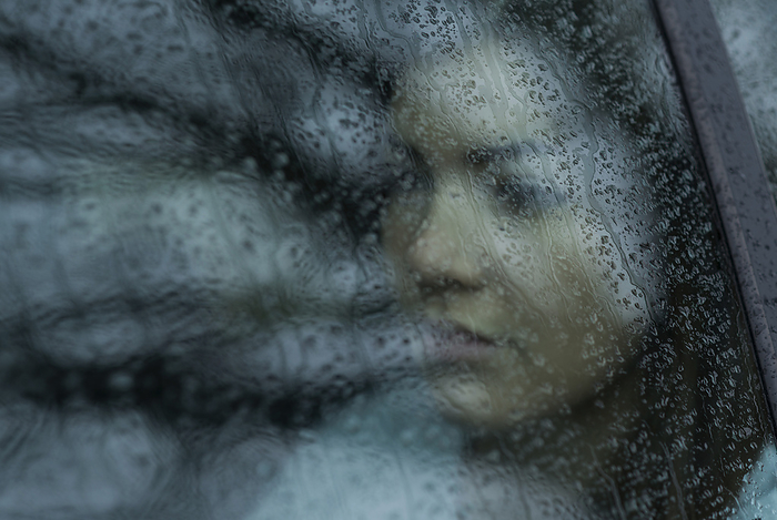 Young Woman in Car on Rainy Day, Mannheim, Baden-Wurttemberg, Germany, by Uwe Umstätter / Design Pics