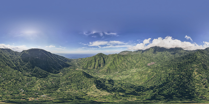 Panoramic overview of Mount Abang and surrounding mountains, with a blue sky, lush vegetation and an ocean view; Abang, Kabupaten Karangasem, Bangli Regency, Bali, Indonesia, by O'Neil Castro / Design Pics