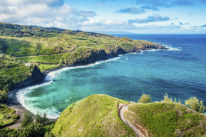 Maui, Hawaii Coastal road and pathway along the hills with the Pacific Ocean surf against the rugged coastline  Maui, Hawaii, United States of America, by Living Moments Media   Design Pics