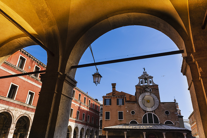 Venice View of San Giacomo di Rialto Square and Church through archway in Veneto  Venice, Italy, by Alberto Biscaro   Design Pics