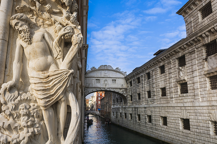 Venice, Palazzo Ducale Legendary, Bridge of Sighs over the Rio di Palazzo, between Doge s Palace and the prisons with gondola passing underneath and relief sculpture on the exterior, palace wall in Veneto  Venice Italy, by Alberto Biscaro   Design Pics