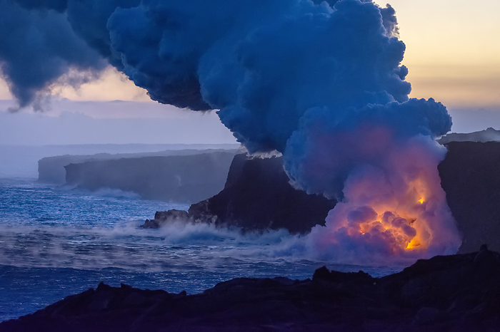 Hawaii Hawaii Island Hot lava illuminates a huge column of noxious gas at the blue hour as it enters the ocean on the Big Island of Hawaii  Hawaii, United States of America, by Jim Lavrakas   Design Pics
