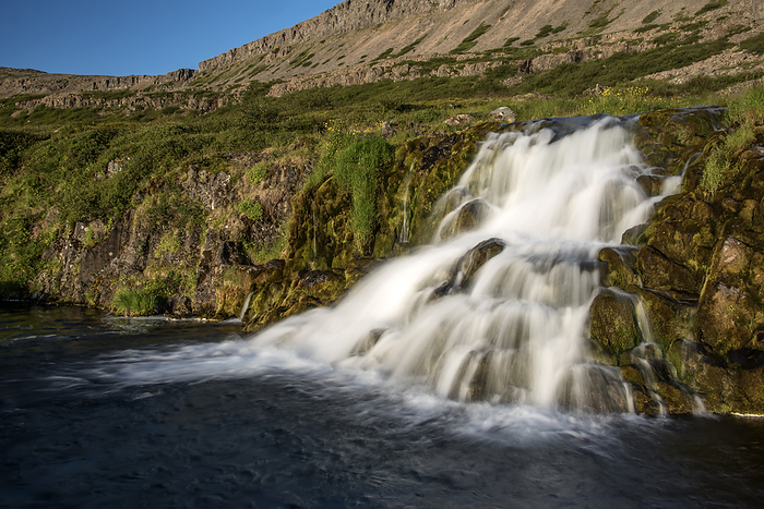Iceland Vie of one of seven of the waterfalls at Dynjandi Waterfalls rushing down the cliffs on the Arnarfj r ur in the Westfjords Region of Iceland  Arnarfjordur, Westfjords, Iceland, by Karen Kasmauski   Design Pics