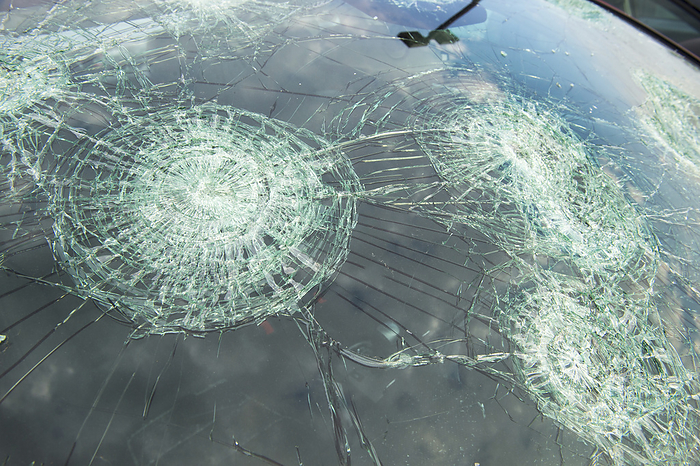 America Severe hail damage on the windshield of a parked car  Blair, Nebraska, United States of America, by Joel Sartore Photography   Design Pics