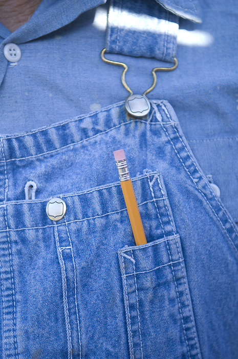 Pencil in the pocket of denim overalls; Cortland, Nebraska, United States of America, by Joel Sartore Photography / Design Pics