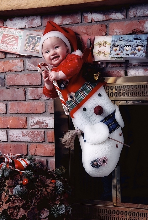 Baby In A Christmas Stocking, by Carson Ganci / Design Pics