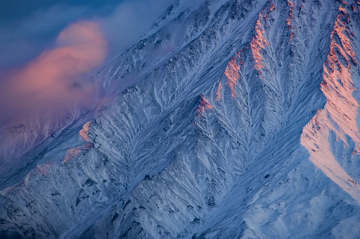 Snow-covered Kronotsky volcano, Russia; Kronotsky Zapovednik, Kamchatka, Russia, by Michael Melford / Design Pics