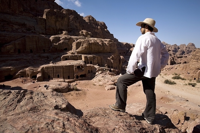 Man Standing Near Monumental Nabataean Tombs, by Deddeda / Design Pics