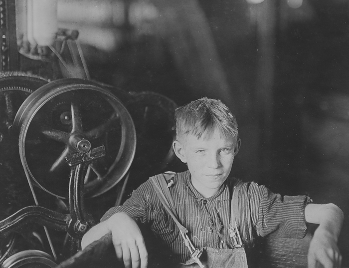 Polish boy working in a spinning mill, U.S.A.  1909  One of the young spinners in the Quidwick Co. Mill. Anthony, R. I.  A Polish boy Willie  who was taking his noon rest in a doffer box.. 