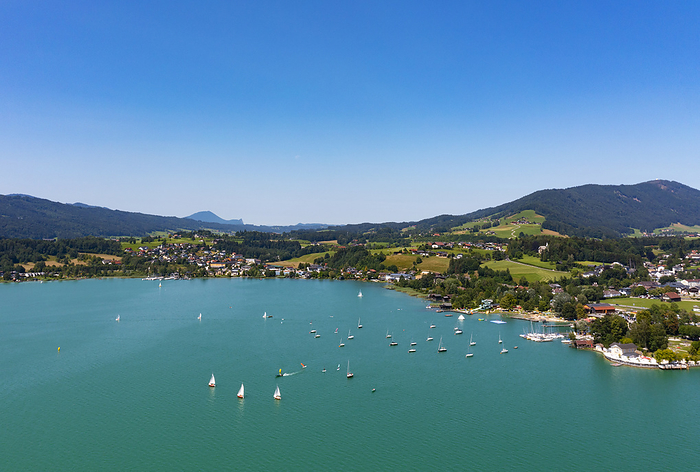 Austria Austria, Upper Austria, Mondsee, Drone view of Mondsee lake and surrounding village in summer