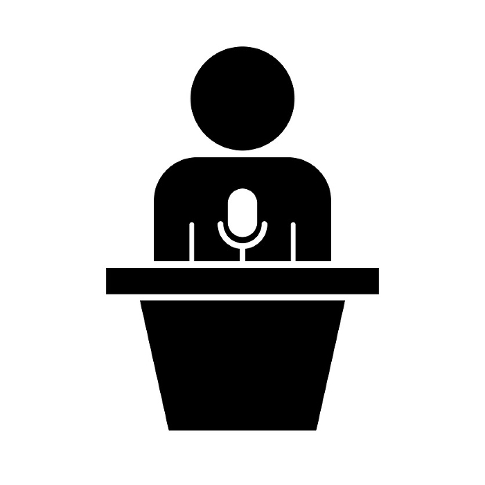 Silhouette icon of a podium with a microphone and a politician