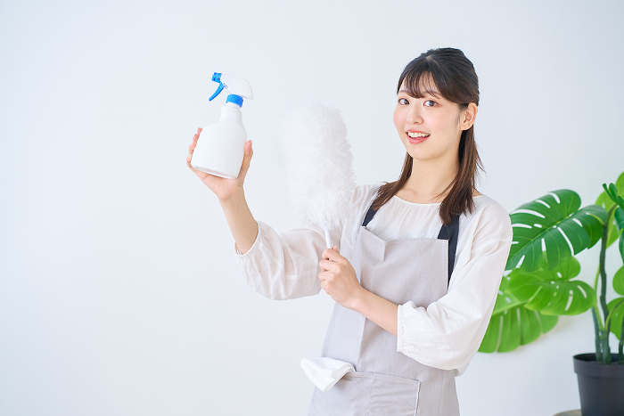 Young Japanese woman with cleaning tools (People)