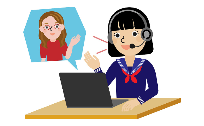 Japanese junior and senior high school girls in sailor suits wearing headsets speaking English with a foreign teacher online.