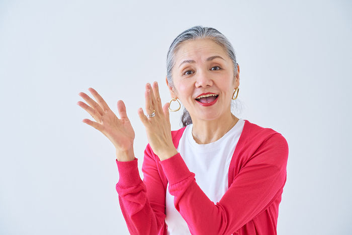 Senior Japanese woman applauding (People)