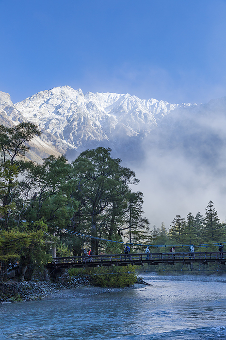 Azusa River, Kappa bashi Bridge, and the Hotaka mountain range with fresh snow Nagano Prefecture  