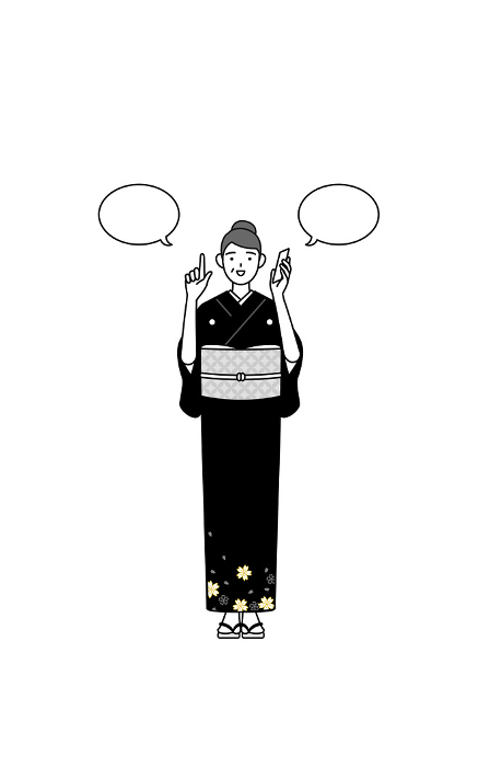 A senior woman in kimono pointing while making a phone call, at a New Year's hatsumode or a wedding, etc.