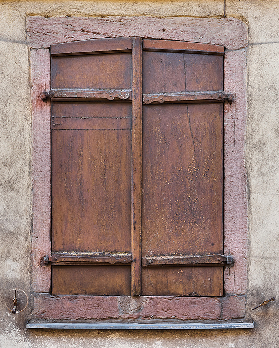 old wooden window shutter on a historical building in the old town of Colmar in France old wooden window shutter on a historical building in the old town of Colmar in France, by Zoonar HEIKO KUEVERL