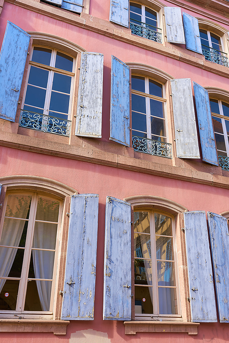 Windows with shutters on the facade of a house in the historic center of Colmar in France Windows with shutters on the facade of a house in the historic center of Colmar in France, by Zoonar HEIKO KUEVERL