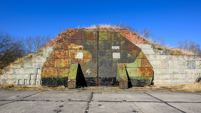 Bunkers and planes on an old Russian airfield Bunkers and planes on an old Russian airfield, by Zoonar Andreas V lk