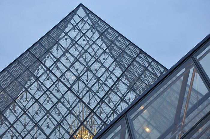 Close view of glass pyramid in the courtyard of the Louvre in Paris, France Close view of glass pyramid in the courtyard of the Louvre in Paris, France, by Zoonar Raffael Herrm