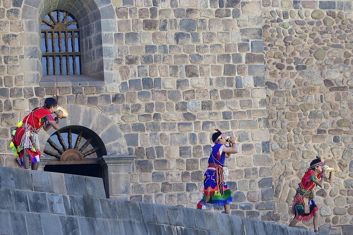 Inti Raymi, festival of the sun, shell blowers on the walls of the Coricancha, the most important temple of the Inca, Cusco, Peru, South America, by Peter Giovannini