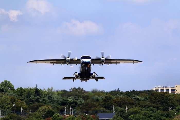 Air travel from Chofu Airfield to the islands of Tokyo... [Dornier 228] flying in the sky