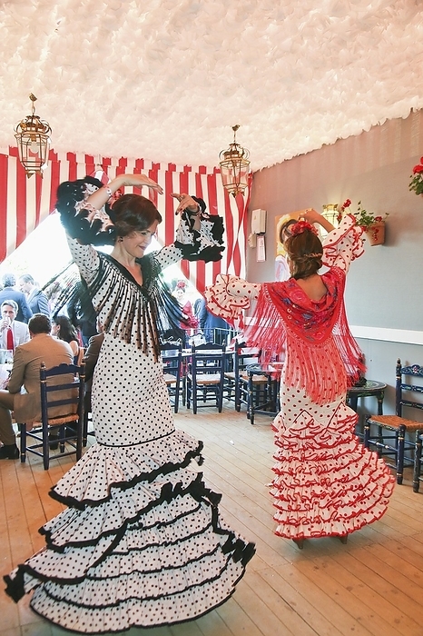 Feria de Abril, woman in flamenco dresses, dancing sevillanas, Seville, Andalusia, Spain, Europe, by Clara Montes