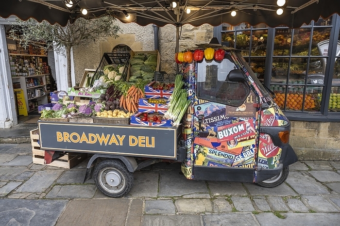 A Piaggio Ape tricycle as a vegetable stall on the high street of Broadway, Cotswolds, Worcestershire, England, United Kingdom, Europe, by Markus Keller