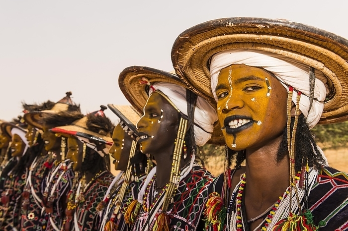 Wodaabe-Bororo men with faces painted at the annual Gerewol festival, courtship ritual competition among the Woodaabe Fula people, Niger, Africa, by Michael Runkel