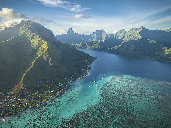 Sailing boats near the Moorea shore in the morning, by Cavan Images / Evgeny Vasenev