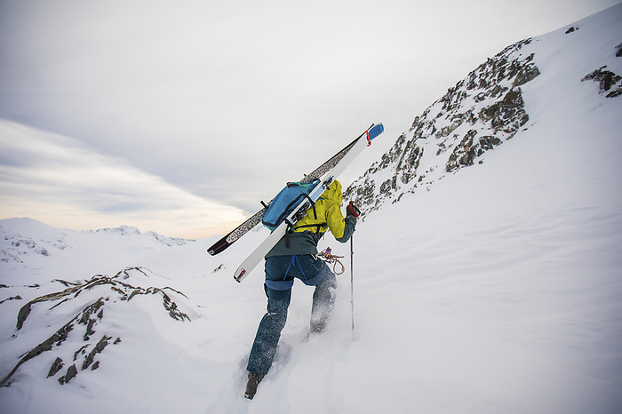 Skier bootpacks as he approaches the mountain summit, by Cavan Images / Christopher Kimmel / Alpine Edge Photography