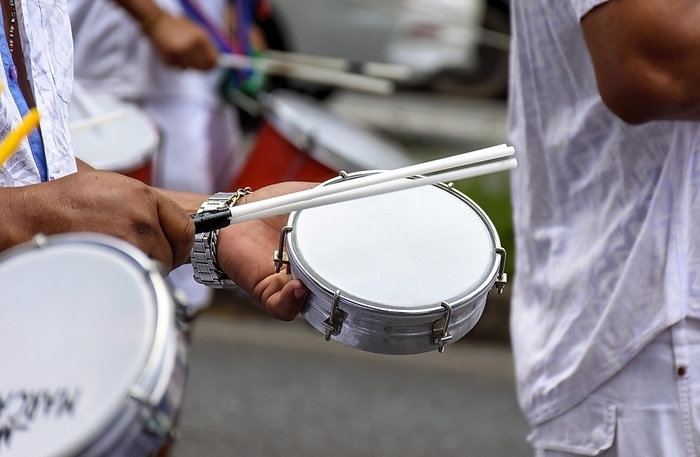 Tambourines being played in the streets of the city of Belo Horizonte during a samba performance at the Brazilian street carnival, Brasil, by Fred Pinheiro