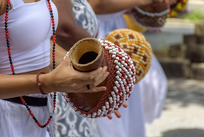 Woman playing a type of rattle called xereque of African origin used in the streets of Brazil during samba performances at carnival, Brasil, by Fred Pinheiro