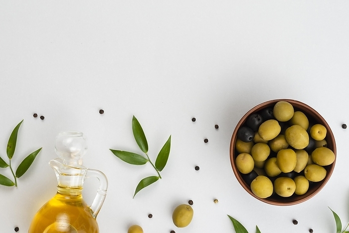 Flat lay olives bowl oil bottle. Resolution and high quality beautiful photo, by Oleksandr Latkun
