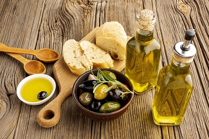 High angle olives mix bread oil bottles. Resolution and high quality beautiful photo, by Oleksandr Latkun