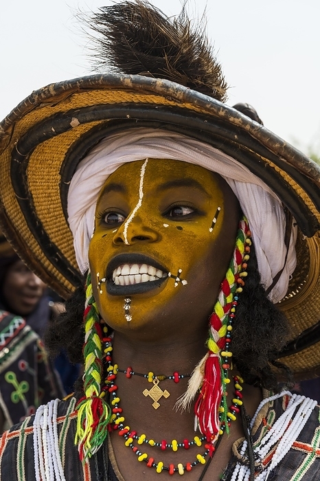 Wodaabe-Bororo man with face painted at the annual Gerewol festival, courtship ritual competition among the Fulani ethnic group, Niger, Africa, by Michael Runkel