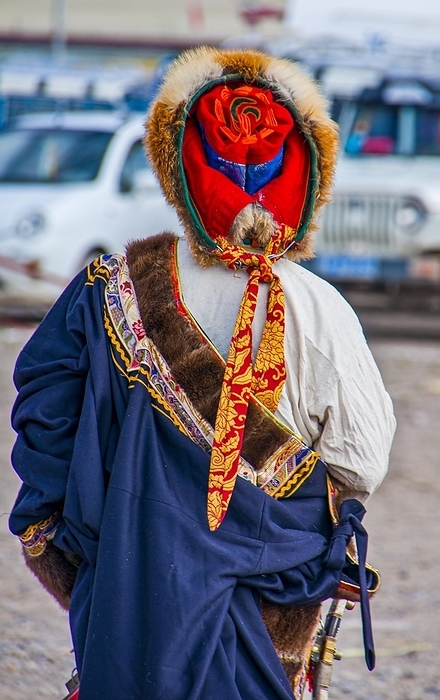 Traditional dressed man on the festival of the tribes in Gerze, Western Tibet, Asia, by Michael Runkel