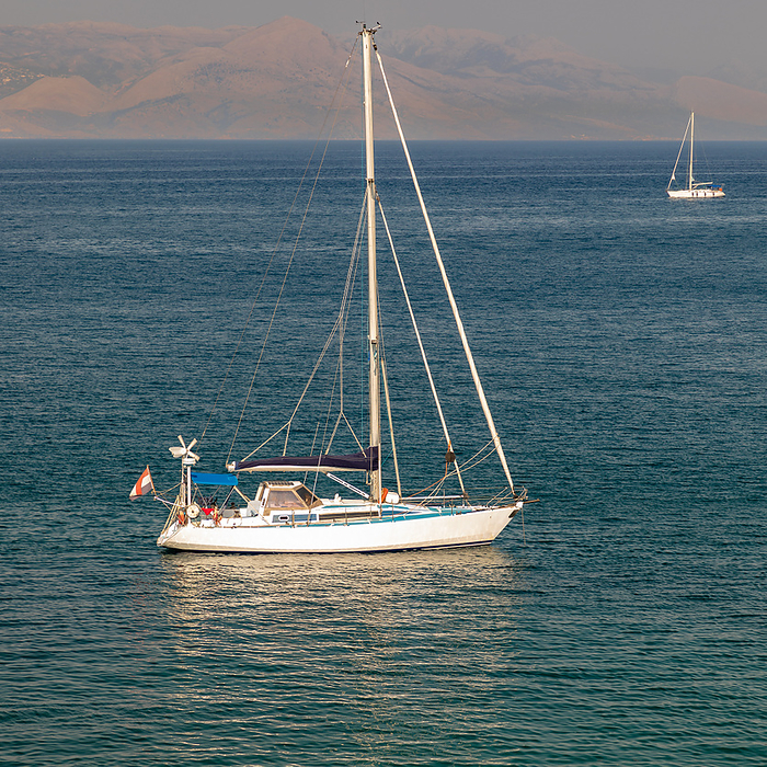 Sailing boat in the Ionian Sea near Corfu Sailing boat in the Ionian Sea near Corfu, by Zoonar ROBERT JANK