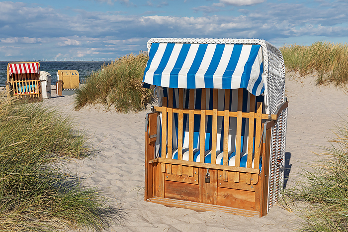 A strandkorb in the dunes at the beach of the Baltic Sea near Heiligenhafen A strandkorb in the dunes at the beach of the Baltic Sea near Heiligenhafen, by Zoonar Thorsten Schi
