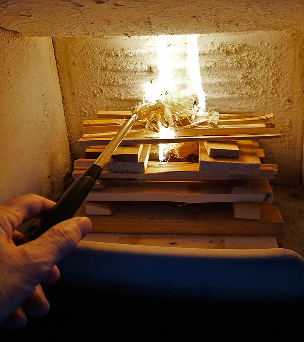 Wood burning stove, example of properly lighting a fireplace Wood burning stove, example of properly lighting a fireplace, by Zoonar J rgen Vogt