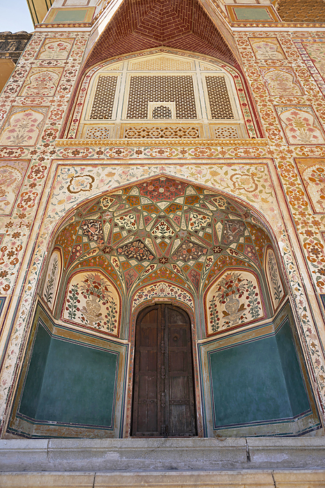 Colourful frescoes on Ganesh Pol or Ganesh gate. This entrance is the entry into the private palaces of the Maharajas at Amber fort, Jaipur, Rajasthan, India Colourful frescoes on Ganesh Pol or Ganesh gate. This entrance is the entry into the private palaces of the Maharajas at Amber fort, Jaipur, Rajasthan, India, by Zoonar RealityImages