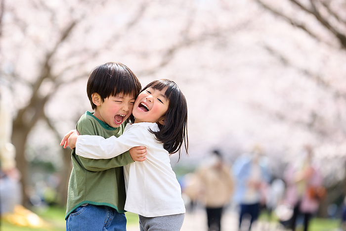 Japanese children hugging each other