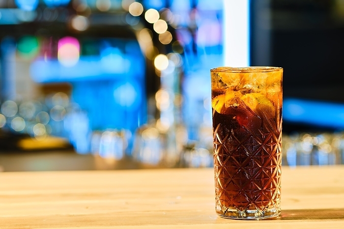 Classic cold cocktail rum and cola (soft focus photo with shallow depth of field)