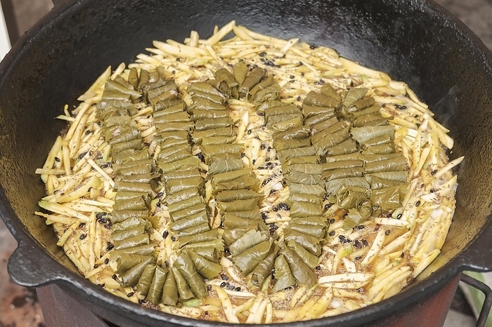 Meat and dolma in cauldron. The making of pilaf, step by step