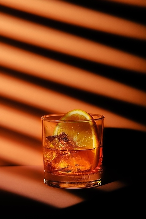 Low key photo of cocktail with brandy and orange liquor, cinnamon and star anise