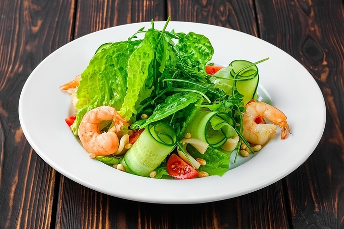 Lenten salad with shrimps, squid, cucumber, tomato and pine nut
